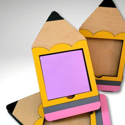 Mommie Peas Creations laser cut wooden pencil Post-it note holder, yellow with pink eraser and grey band, holds 3x3 notes.