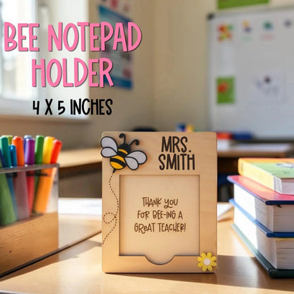 Mommie Peas Creations personalized wooden bee notepad holder with "Mrs. Smith" and "Thank you for bee-ing a great teacher!" engraved.