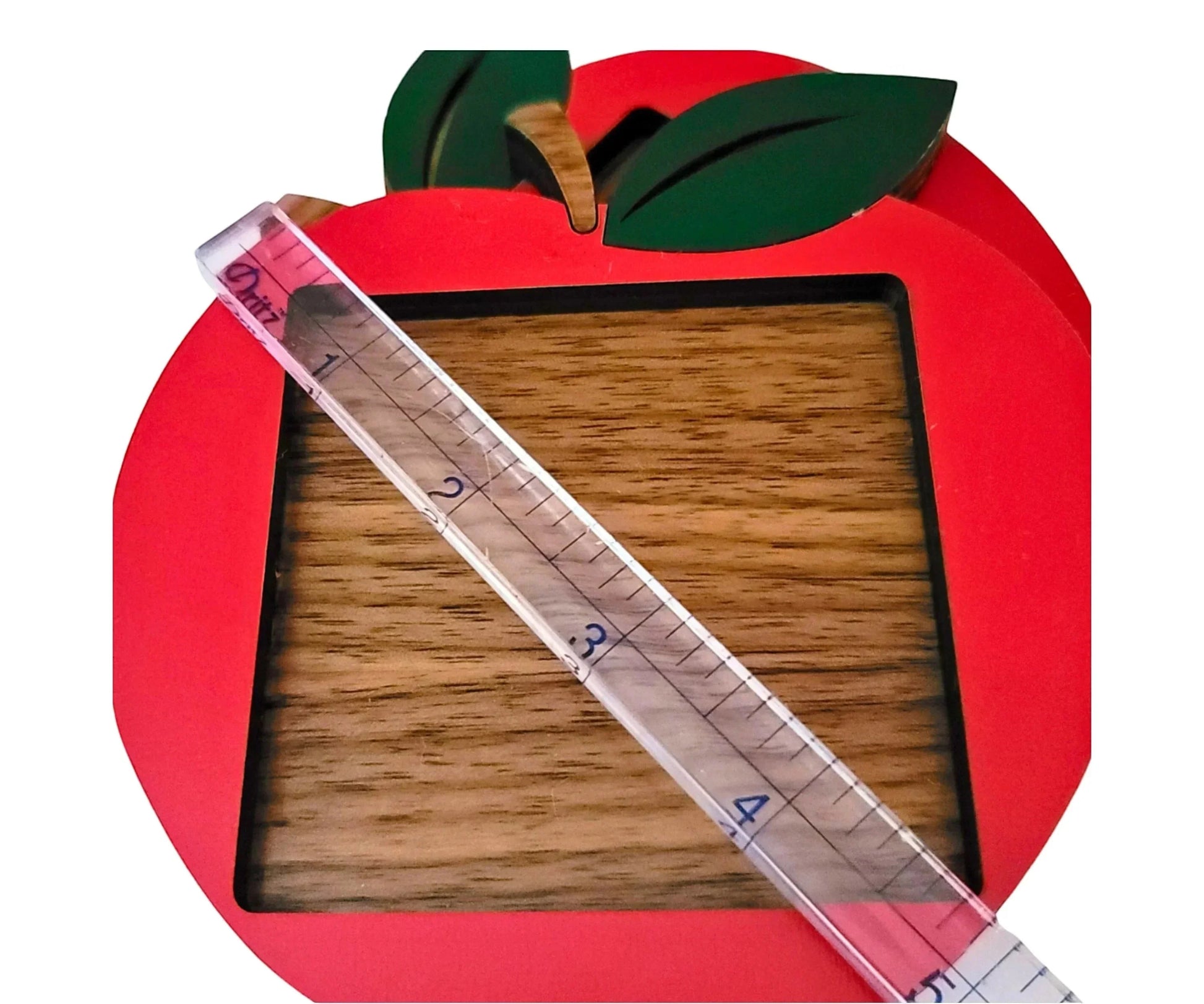 Mommie Peas Creations red apple sticky note holder made of laser cut wood with green leaves and stem, perfect for teachers.