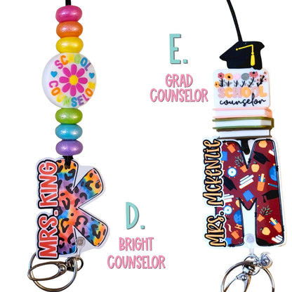 Mommie Peas Creations custom acrylic lanyard with colorful beads, a "School Counselor" charm, and a leopard print initial.