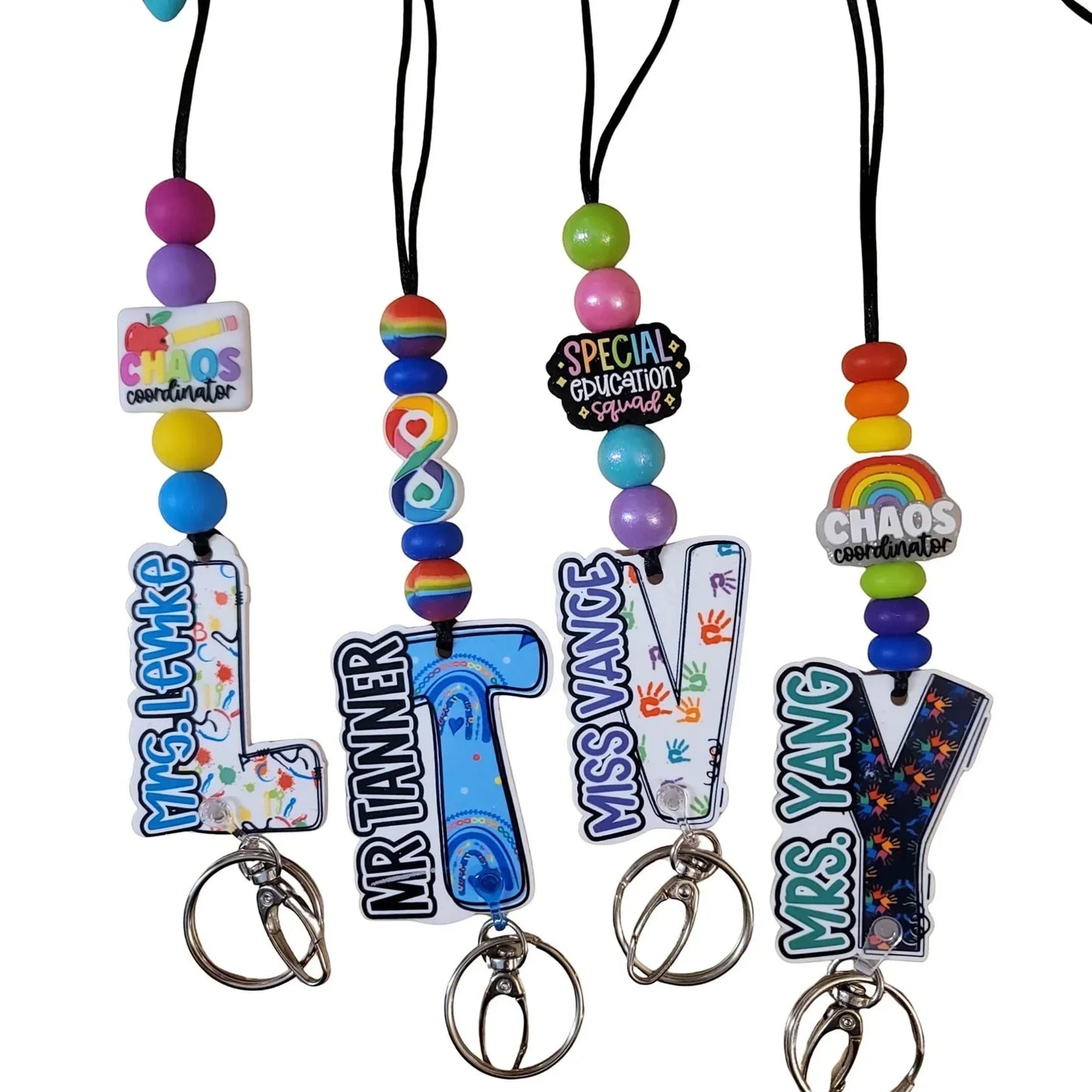 Mommie Peas Creations custom special education teacher lanyard with acrylic ID holder, beads, and keychain. Features 'Chaos Coordinator' and 'Special Education Squad' designs.