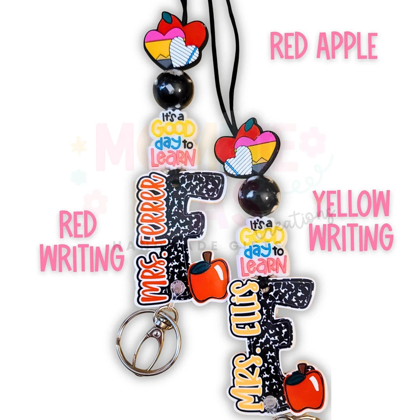 Mommie Peas Creations personalized teacher lanyard with black silicone beads, acrylic charms, and custom letter charms in a notebook paper design. Features a breakaway clasp.