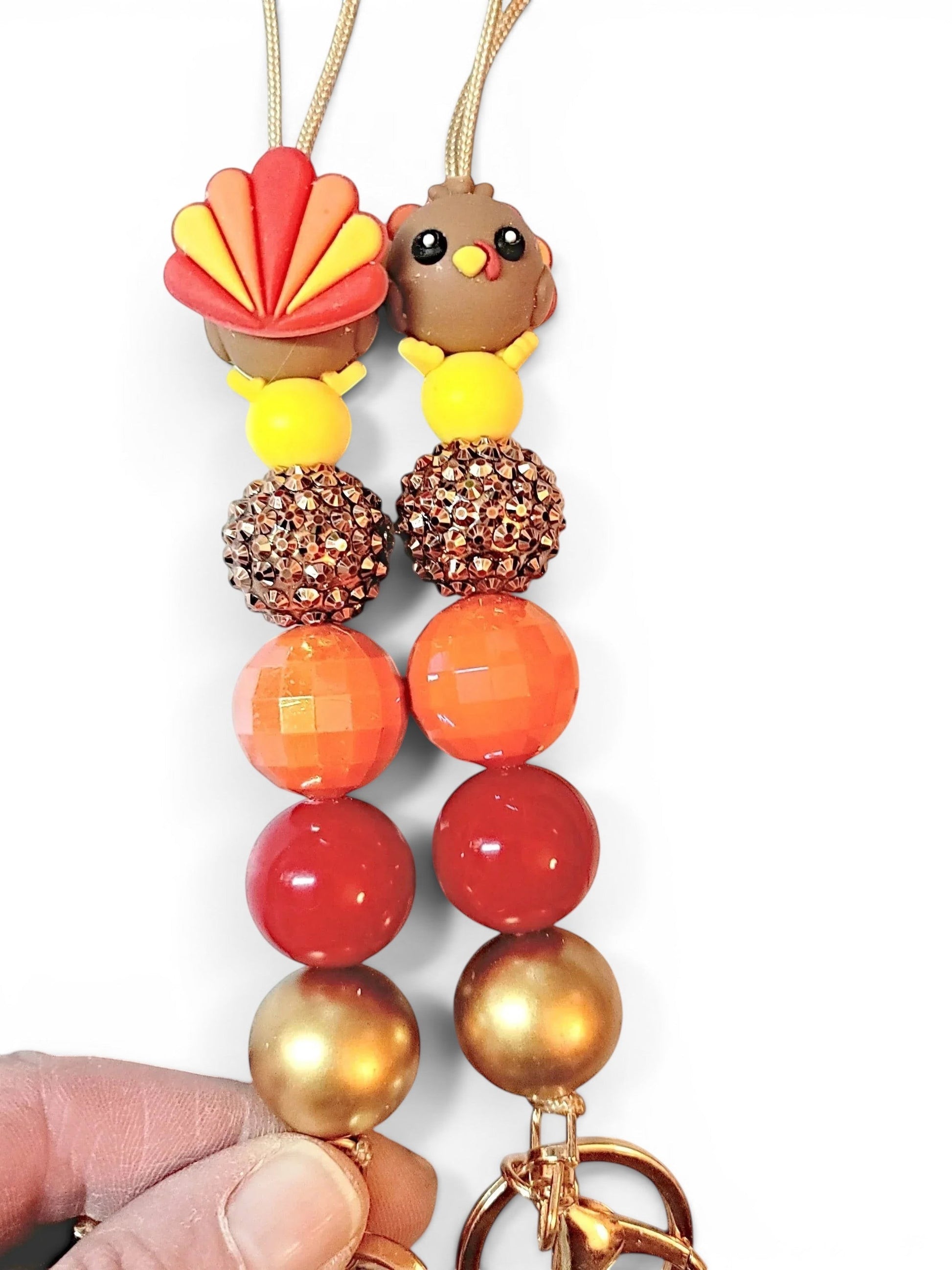 Mommie Peas Creations Thanksgiving beaded lanyard with 3D turkey charm, orange, red, gold, and brown beads, and a breakaway clasp.