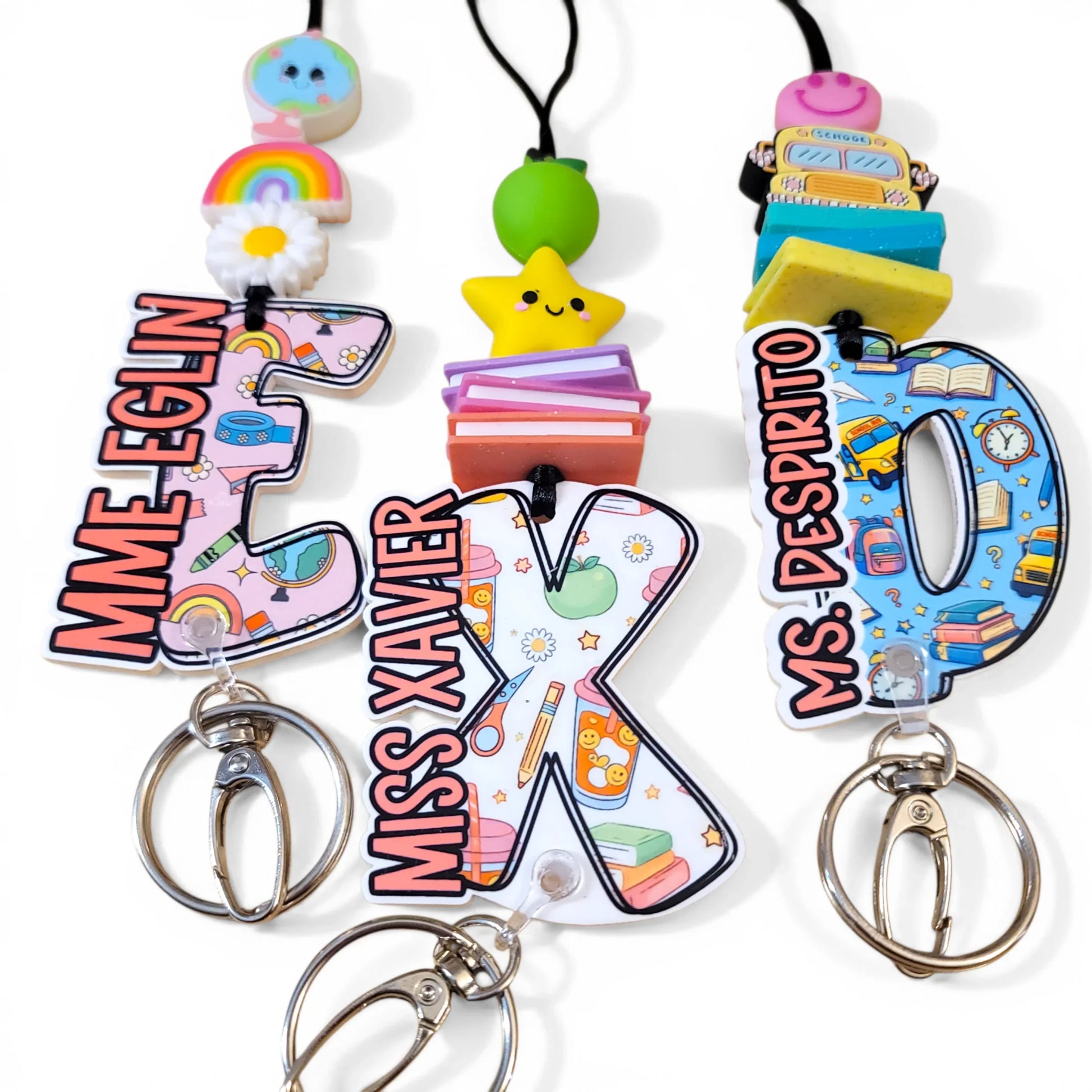 Colorful handmade teacher lanyards with fun charms and custom letter designs, perfect gift.