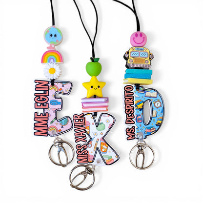 Colorful handmade lanyards with cute charms and large letter initials, personalized teacher gifts